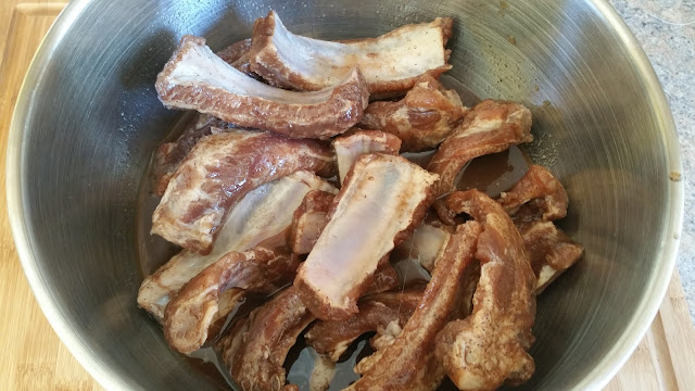 Marinated ribs in a bowl www.fire2feast.com