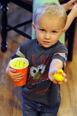 toddler with mini rubber ducky