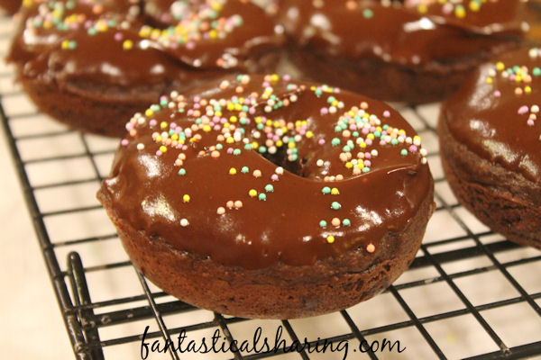 Triple Chocolate Baked Donuts // Breakfast just got a little sweeter with these chocolatey homemade donuts #recipe #chocolate #donuts #breakfast #Choctoberfest