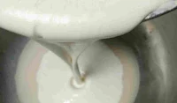 Mixing rice batter with yeast for appam recipe