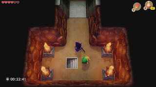 screenshot of Shadow Link facing Link in a small, empty chamber with a staircase in the middle from the Tail Cave dungeon