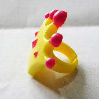 Yellow crown plastic ring from Greggs cakes