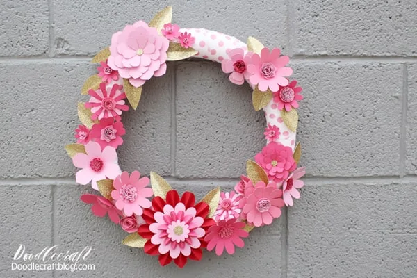 Supplies Needed for Paper Flower Wreath: Cricut Maker Cricut Scoring Wheel Cricut Cardstock 12x24 Red Tones Cricut Cutting Mat (12x24) Cricut Glitter Cardstock Riley Blake Polka Dot Fabric 20" Styrofoam Wreath Hot Glue/Gun Cricut Design Space  And these 5 Cricut Design Space projects: Flowers in Pink Flowers in Red Flowers in Bright Pink Leaves in Gold Accordion Flower  If you don't have 12X24 paper and mats, just use Cricut Access and search for 3D flowers.