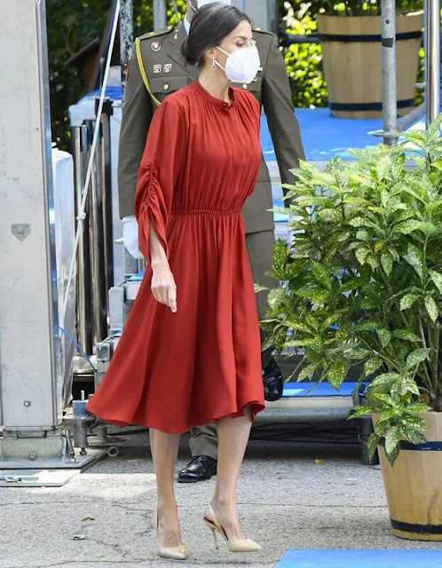 Queen Letizia of Spain wore a red long sleeve flared midi dress by Salvatore Ferragamo