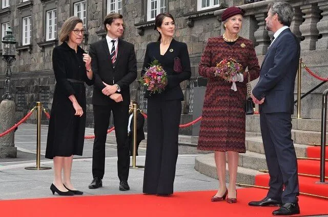 Crown Princess Mary wore a crepe knit wrap jacket by Scanlan Theodore. Queen Margrethe, Princess Benedikte, Prince Frederik