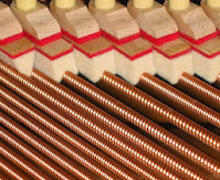 dampers on bass strings in an acoustic piano