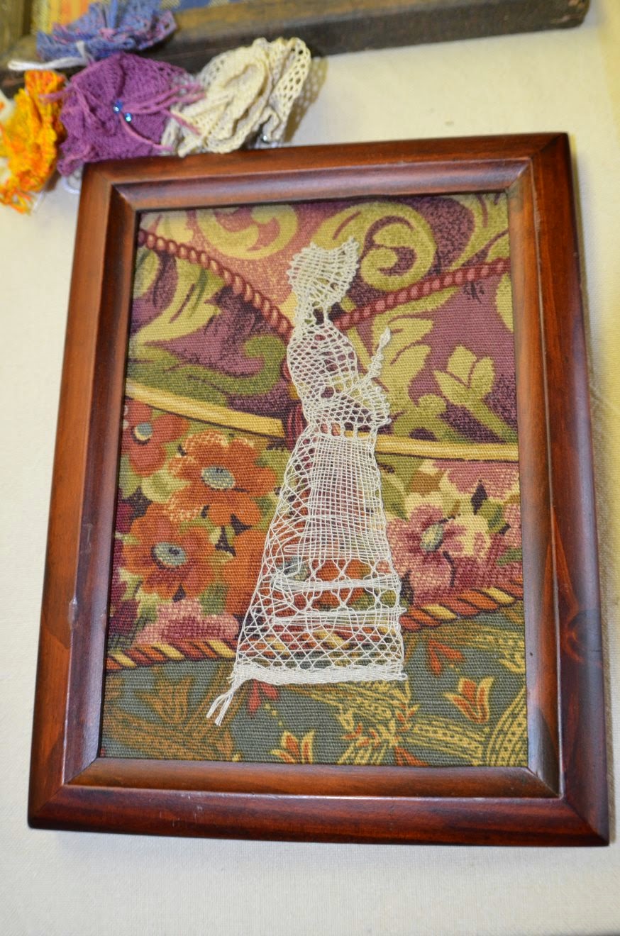 Lady with Bonnet done with bobbin lace method (Photo by Trisha)