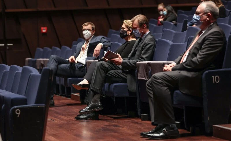 Grand Duchess Maria Teresa wore a black blouse and black trousers, and embroidered black bag