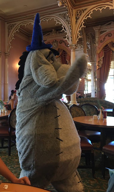Disneyland Characters Wearing a Sorcerer Mickey Hat