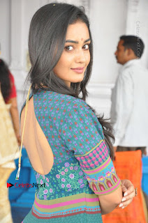 Telugu Actress Tridha Choudhury Stills in Green Long Dress at Anandi Indira Production LLP Production no 1 Opening  0014