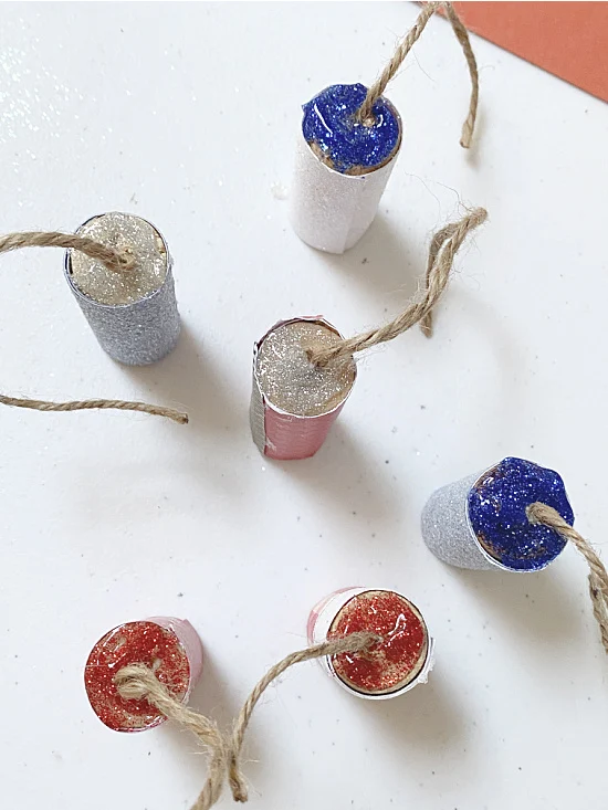 top of firecrackers filled with glitter glue