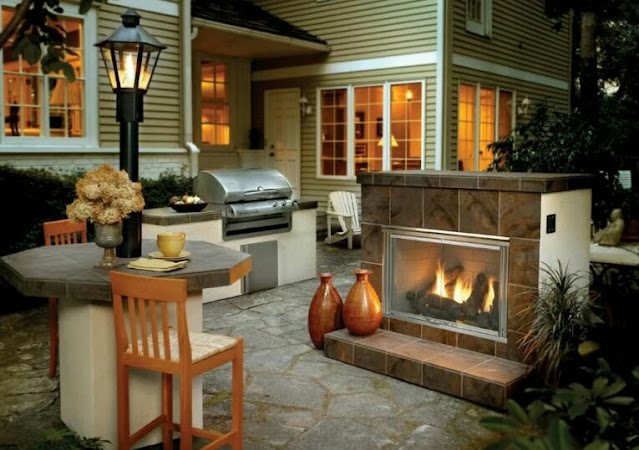 covered outdoor living spaces with fireplace