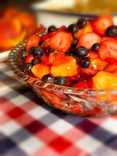 Stain Glass Fruit Salad, fresh pineapple chunks, fresh strawberry slices, and fresh blueberries tossed all together in a strawberry pie filling, homemade or canned.    Light and fresh...who says it can't be for dessert!