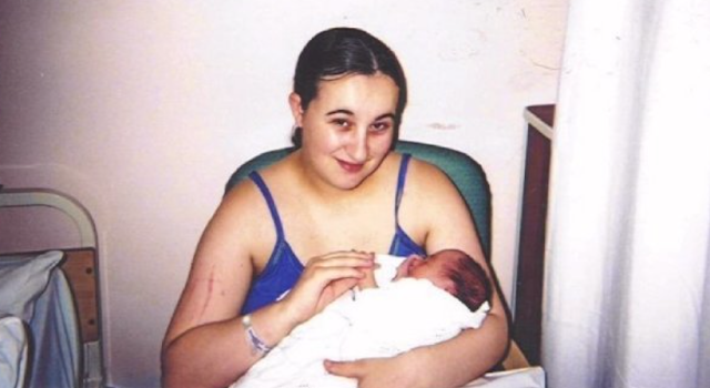 Me holding my eldest when she was a day old.