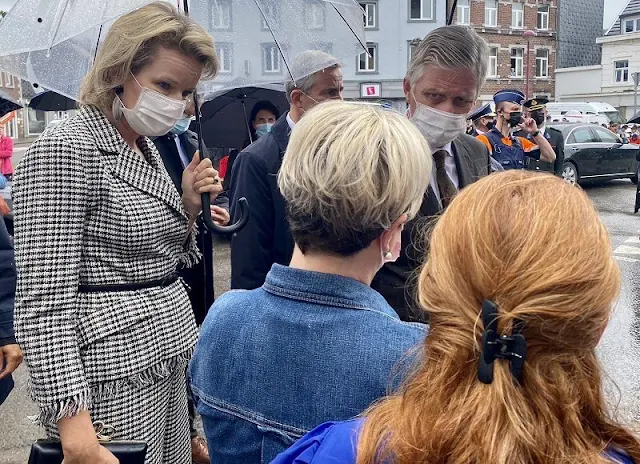 Queen Mathilde wore a tweed jacket from Natan, and The Queen wore grey checked plaid trousers from Natan