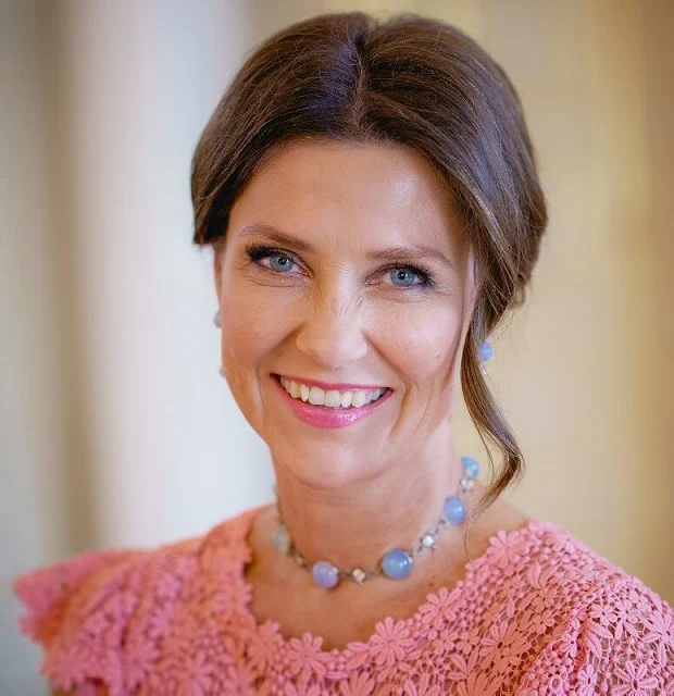 Princess Martha Louise wore a pink lace dress by Valentino. Emilio Pucci blue lace blouse. Crown Princess Mette-Marit wore the same dress