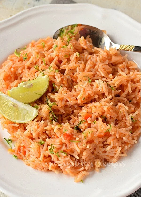 a close up of a white plate with restaurant style mexican rice