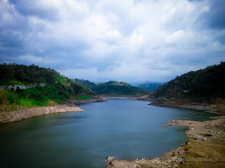 Landscape View Of Titab Ularan Dam Between The Hills In The Sunny Cloudy Day In The Dry Season North Bali Indonesia