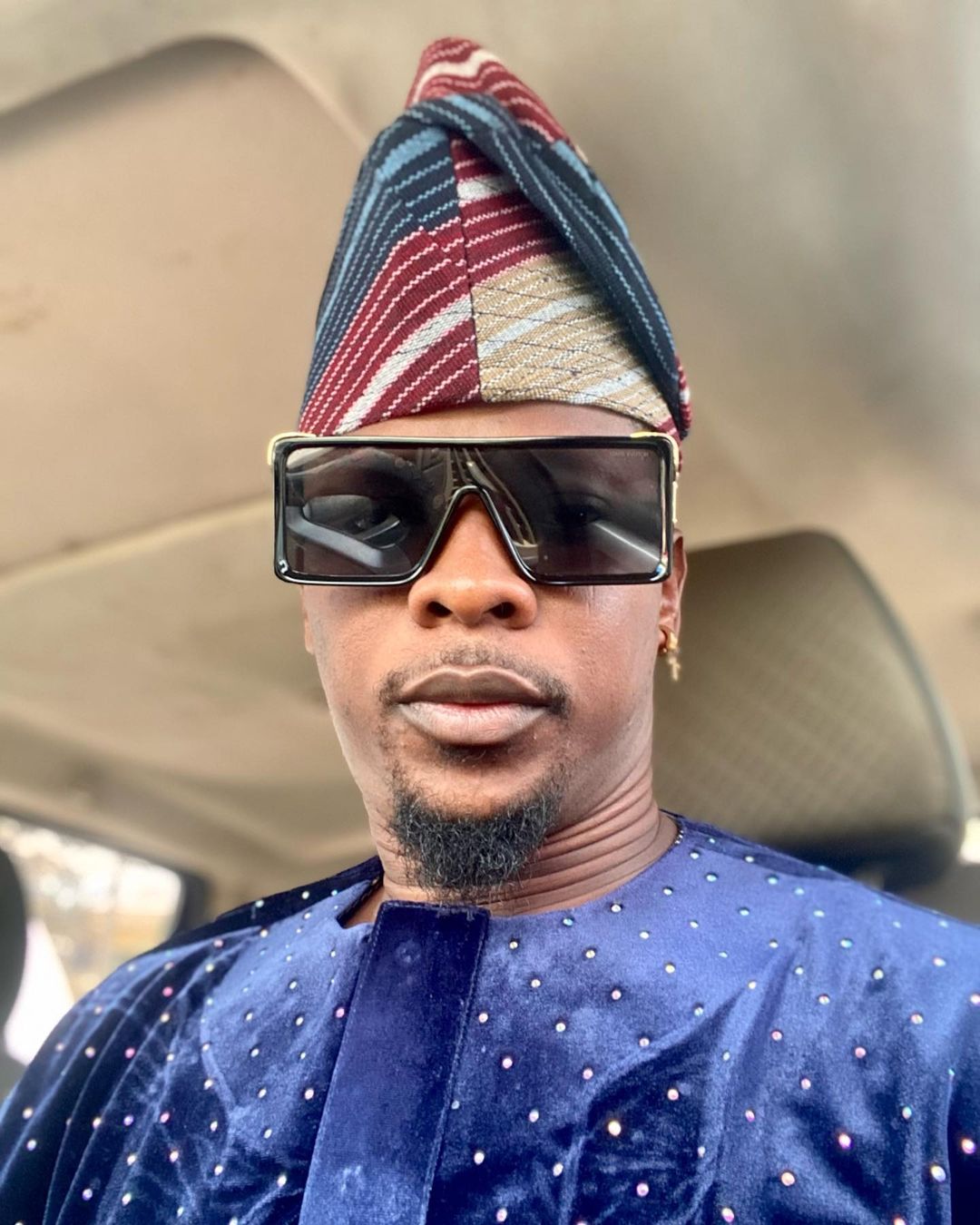 Pictures of Rotimi Salami in his car