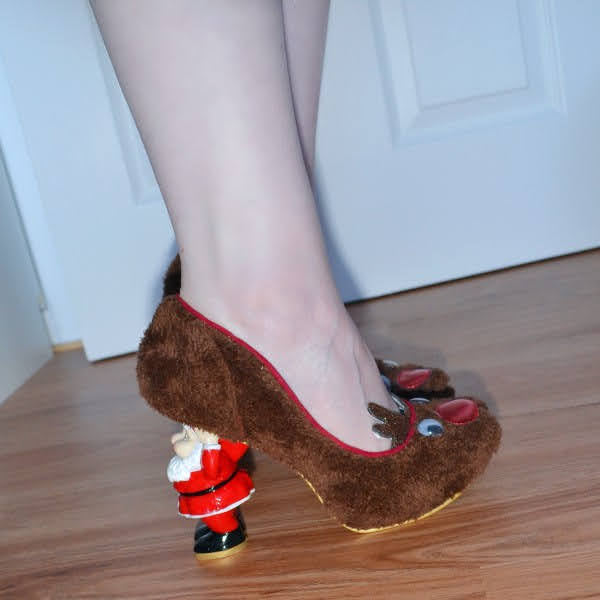 wearing brown rudolph reindeer shoes with fluffy uppers and Santa heel