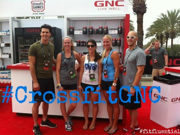 Fitfluential Reebok bloggers at the 2012 CrossFit Games in front of the GNC Live Well booth