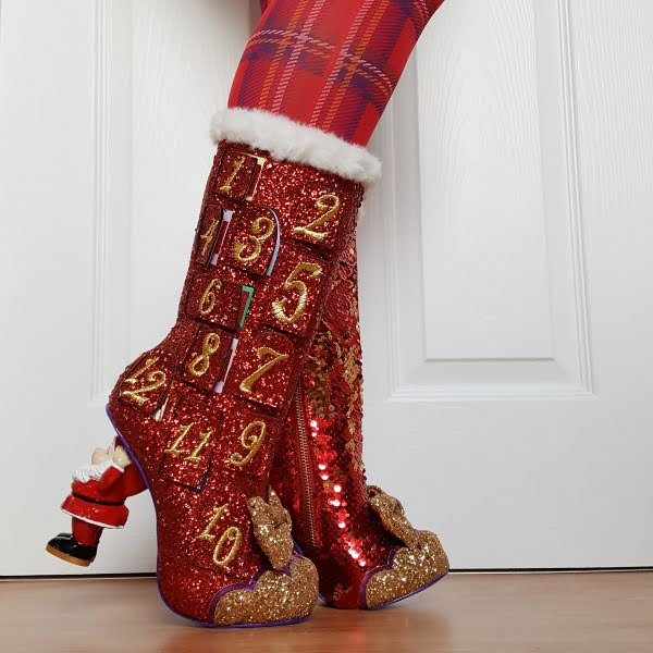 Christmas 2020 red glitter boots with Santa shaped heel worn with tartan tights