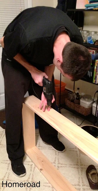 drilling pilot holes for the shelves in this diy storage project
