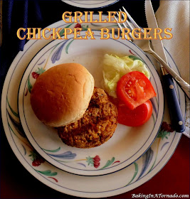 Grilled Chickpea Burgers come together in the food processor. They’re full of vegetable flavor enhanced by charring them on the grill. | Recipe developed by www.BakingInATornado.com | #recipe #dinner
