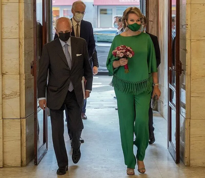 Queen Mathilde wore a new green fringed crepe top and crepe straight leg pants from Carolina Herrera