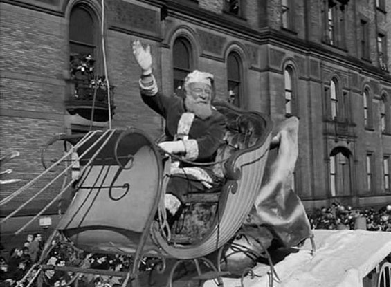 Kris Kringle riding in a sleigh in Miracle on 34th Street