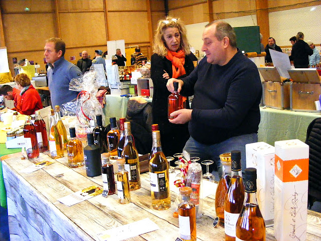 Products from Cognac at the Saffron Fair, Preuilly sur Claise.  Indre et Loire, France. Photographed by Susan Walter. Tour the Loire Valley with a classic car and a private guide.
