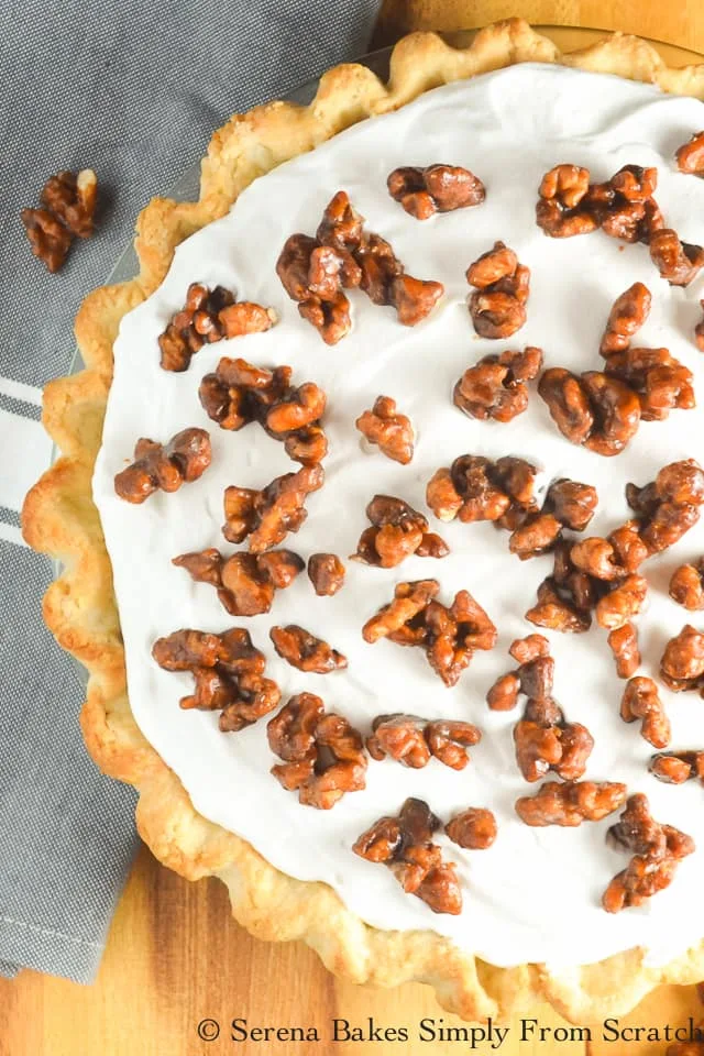 Cover Butterscotch Banana Pudding Pie with Toffee Walnuts! A favorite recipe for Thanksgiving and Christmas dessert from Serena Bakes Simply From Scratch.