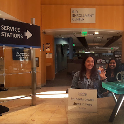 Photo of Rio Salado front reception employees waving and smiling.