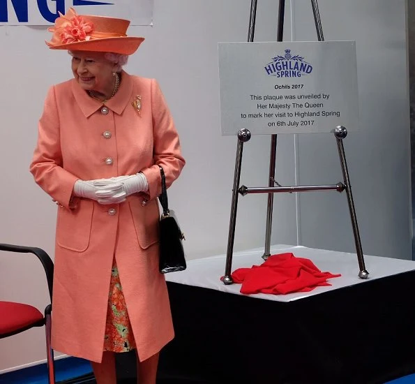 Queen Elizabeth II visited the new Highland Spring factory building in Blackford. The Queen style. wore pink coat and flower dress