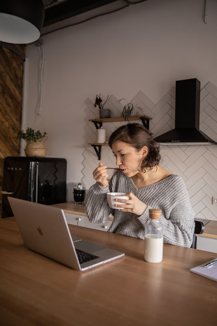 https://www.pexels.com/photo/young-woman-using-laptop-during-breakfast-4049879/