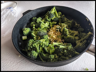 Broccoli Ginger and Garlic in pan to start cooking for Stir Fry step 2 in making Immune system triple punch Broccoli Stir Fry.
