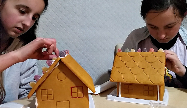 My girls decorating gingerbread houses