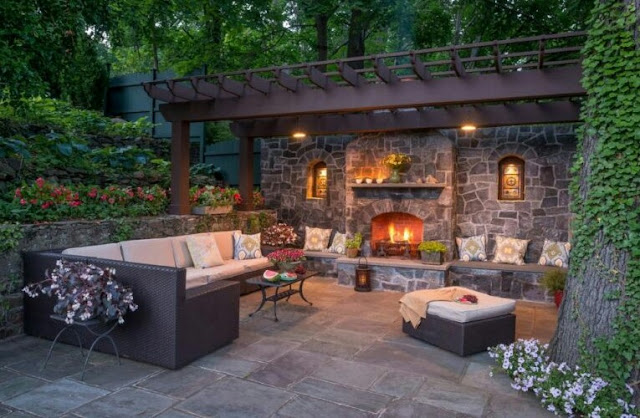 covered outdoor living spaces with fireplace