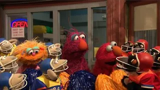There are two football teams The Sheep and The Penguins. Elmo, Zoe and Telly cheer for them. Sesame Street Episode 4420, Three Cheers for Us, Season 44