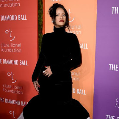  Rihanna Shows Off “Baby Bump” At An Event