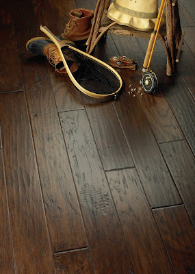 Dark, hardwood floor subtly reflects light because of its finish