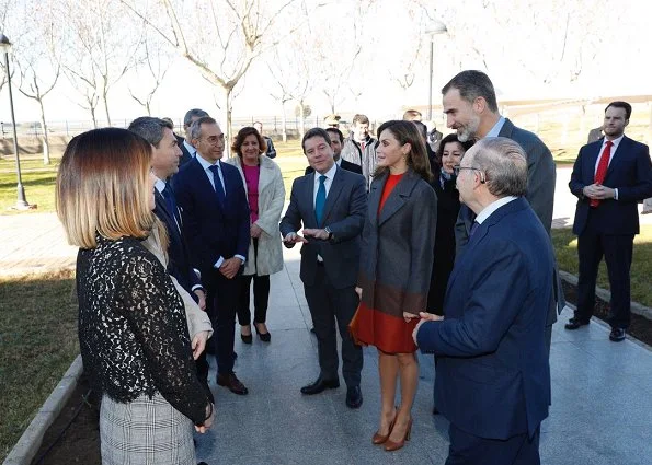 Queen Letizia wore Hugo Boss colorina wool blend cashmere striped coat and skirt and she wore Uterqüe pumps, Tous earings at Joma Sport
