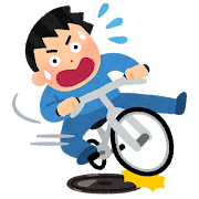 マンホールで滑る自転車のイラスト