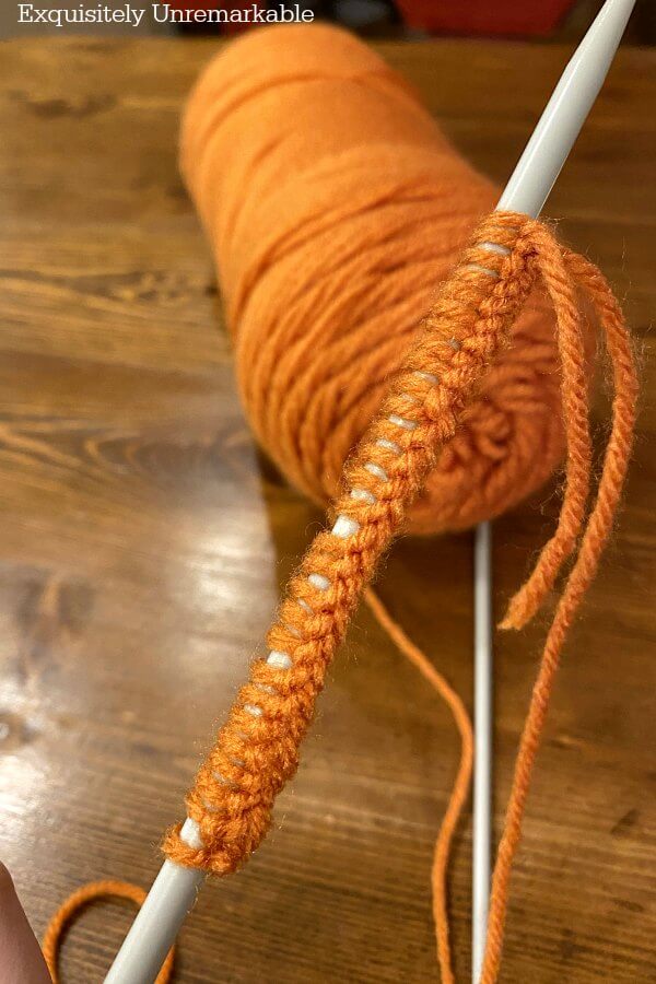 Knitting Yarn Pumpkins with orange yarn on needles