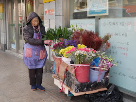 woman selling flowers from a cart in Hongkou, Shanghai