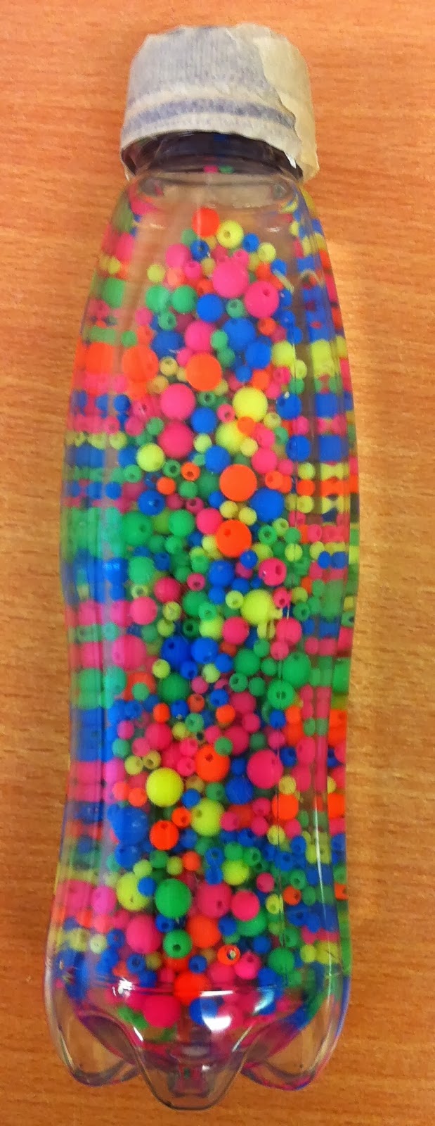 Early language skills through play....... Bead sensory bottle.....