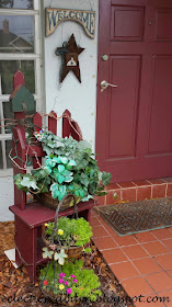 Eclectic Red Barn: Two-tiered planter with picket bench at front door