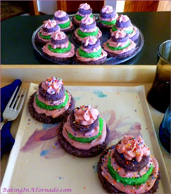 Spring Snack Cakes, raspberry frosting between most layers springtime colored cake. Fun and festive. | Recipe developed by www.BakingInATornado.com | #recipe #cake #bake