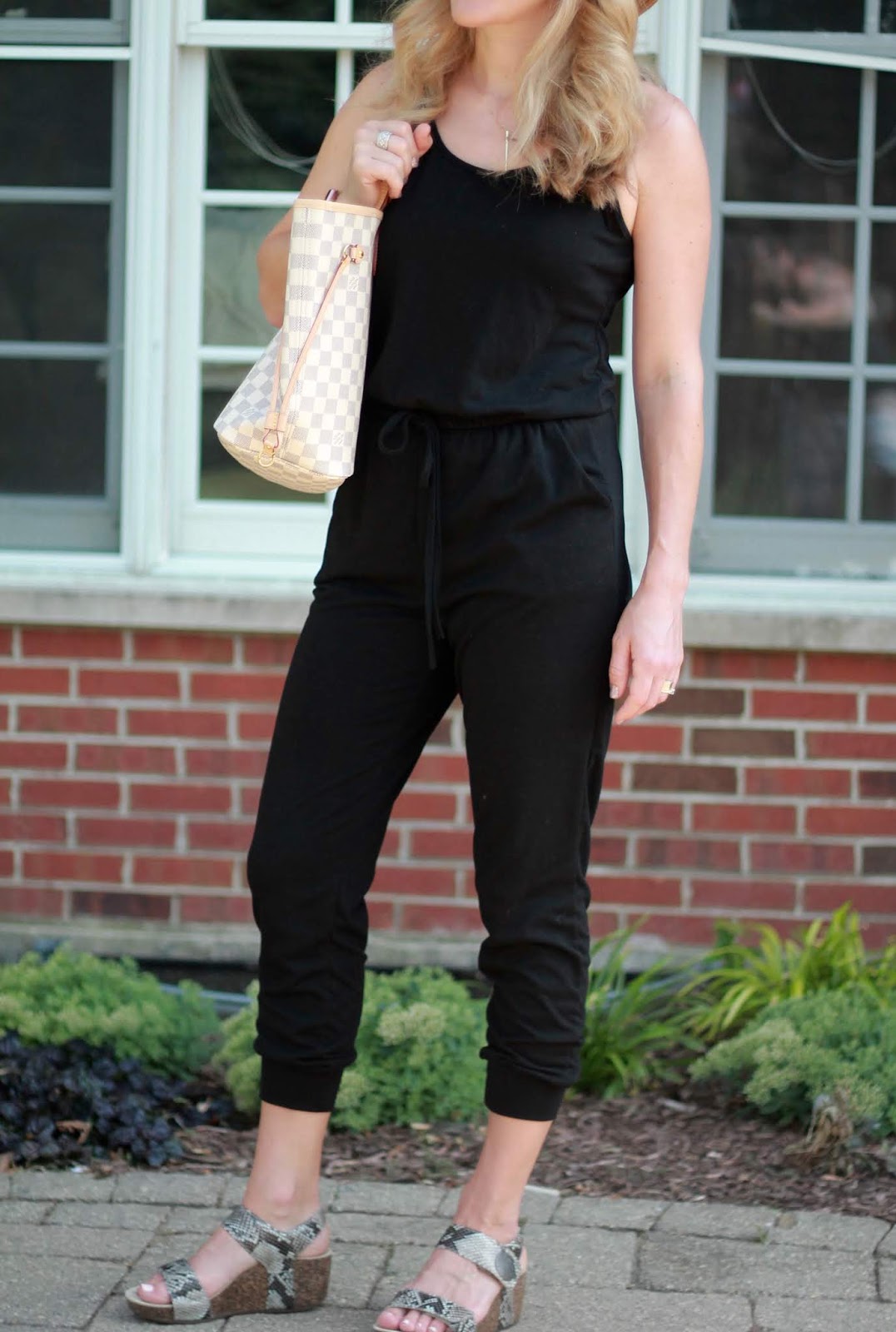 black jumpsuit with wedges
