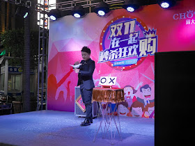 magician with a white dove dancers at Chotef (周大发) promotion for Singles Day in Zhongshan